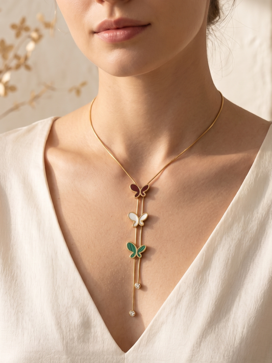 Delicate anti tarnish necklace with butterfly and leaf pendants