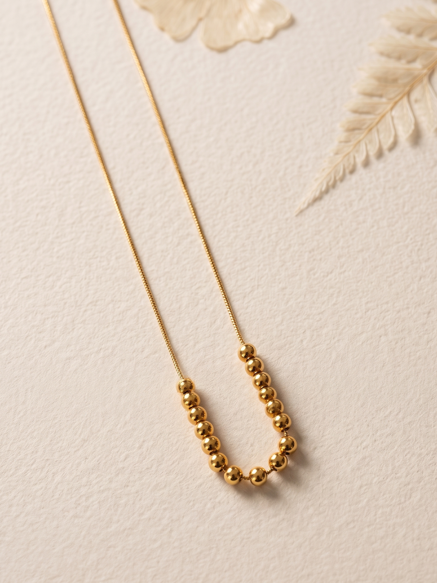 Gold beaded necklace
