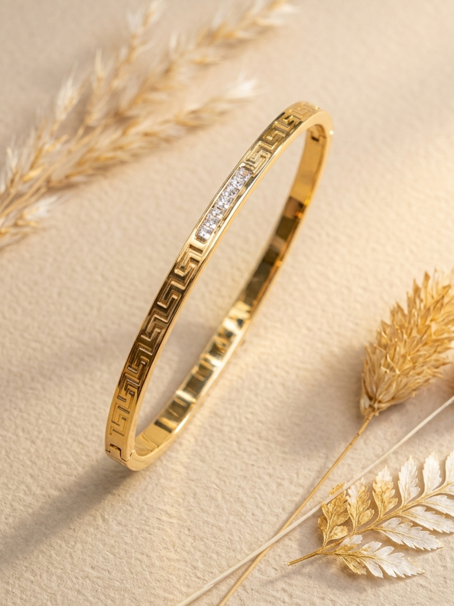Gold bracelet with embedded stone 