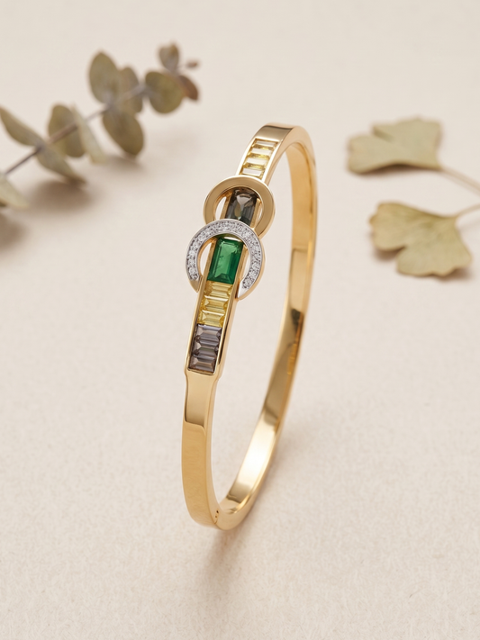 Gold bracelet with green gemstone and diamond accents