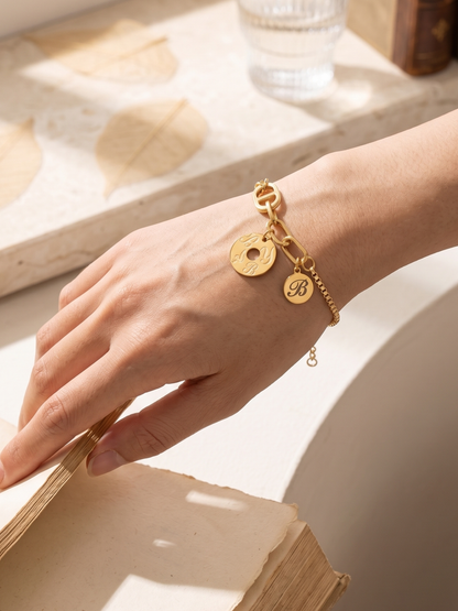 Gold bracelet with engraved charms