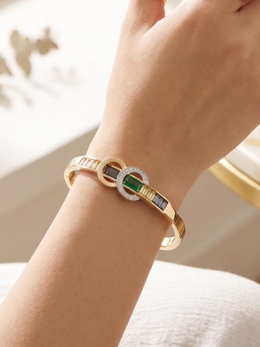 Gold kada with a green stone