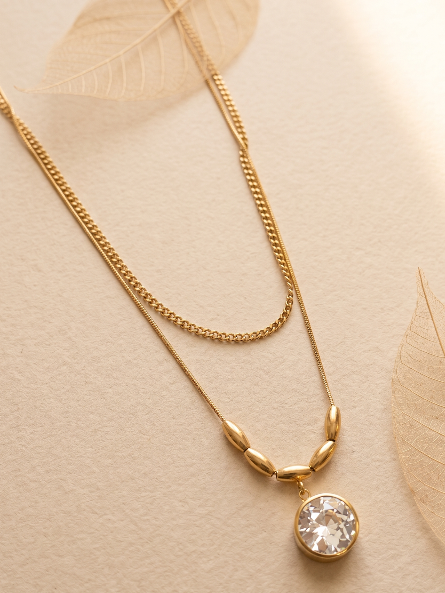 Gold lookalike necklace with a crystal pendant