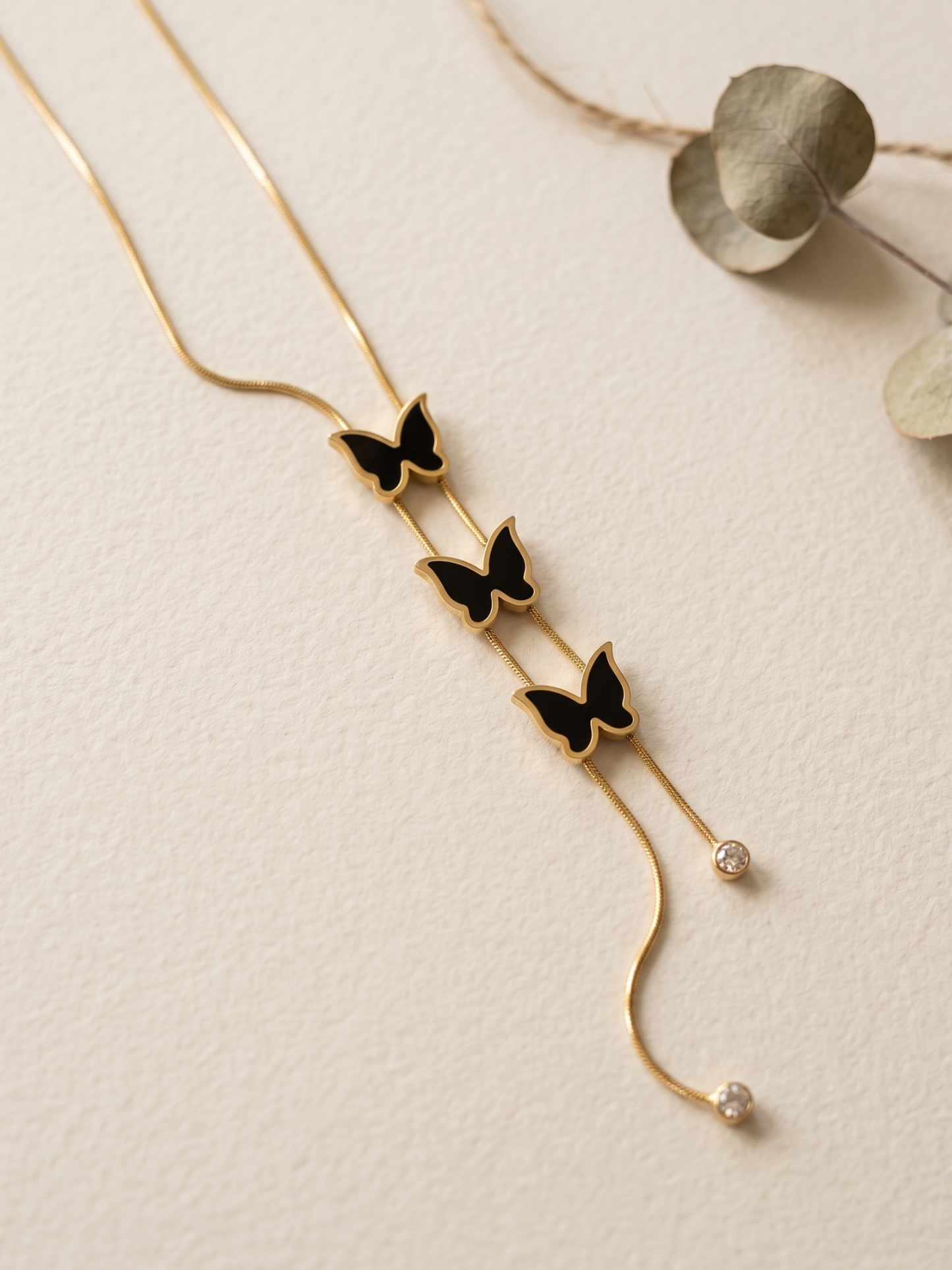 Gold necklace with butterfly pendants