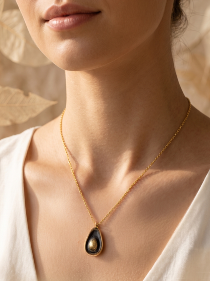 Necklace with a black teardrop pendant