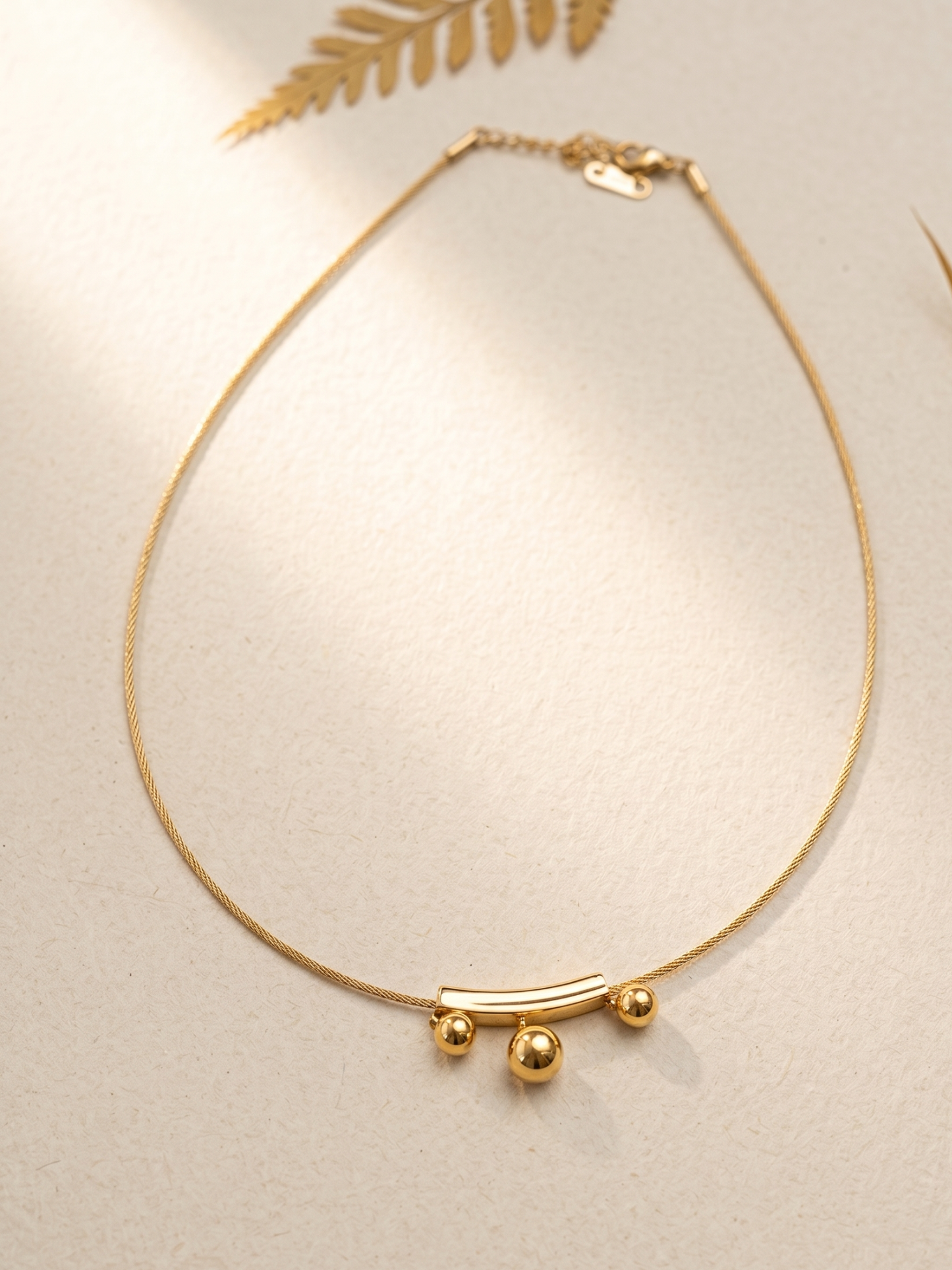 anti tarnish hasli necklace with three spherical pendants 