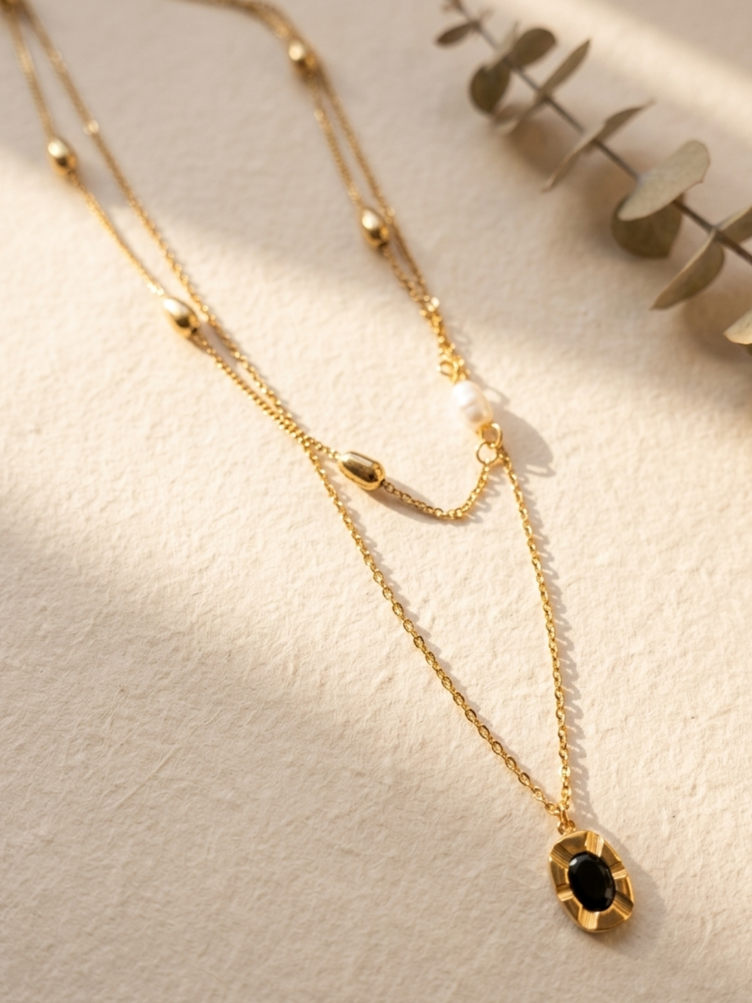 tarnish free doble layer necklace with a black pendant 
