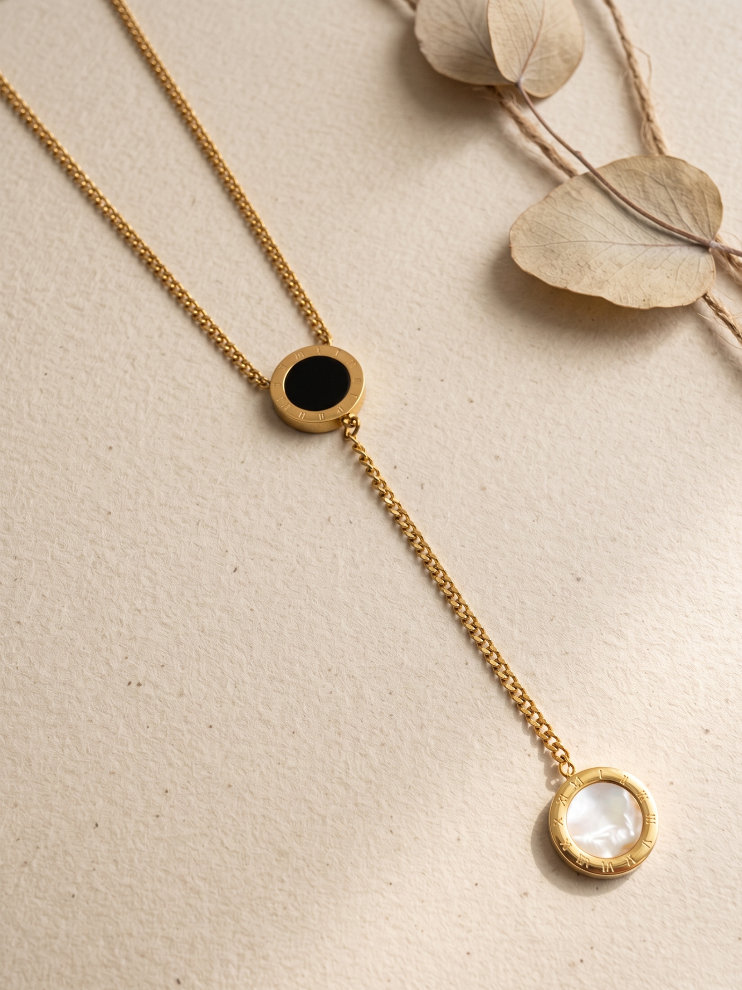 tarnish free necklace with a blackand white pendant