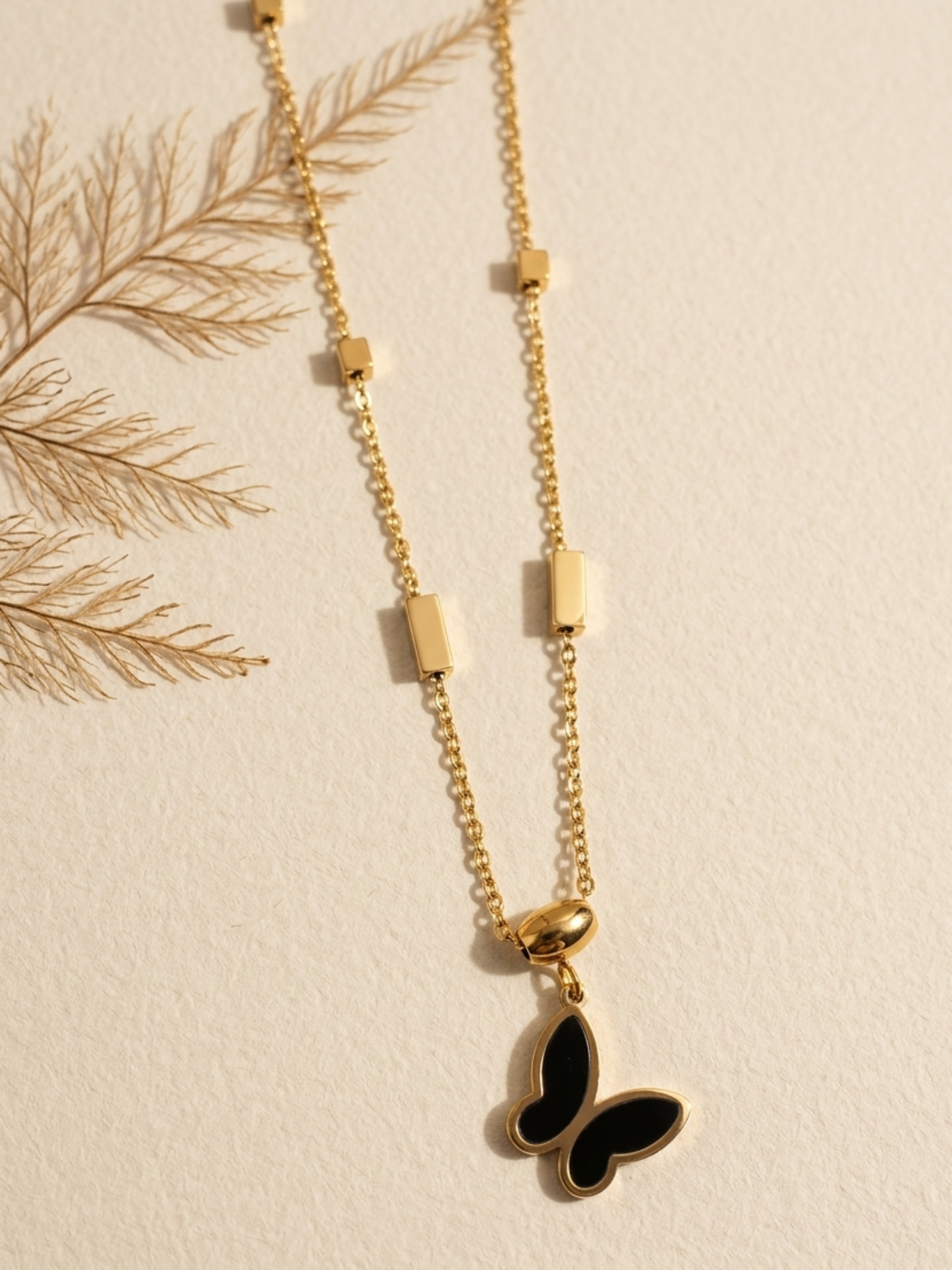tarnish free necklace with a black butterfly pendant