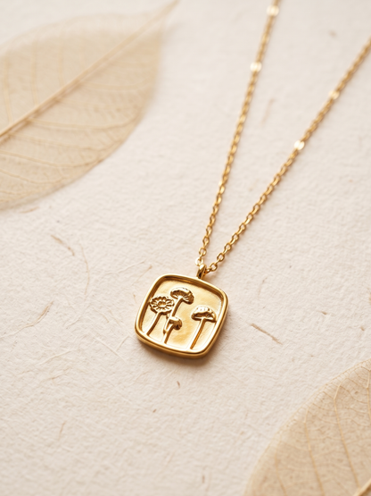 tarnish free necklace with a square pendant featuring floral designs 
